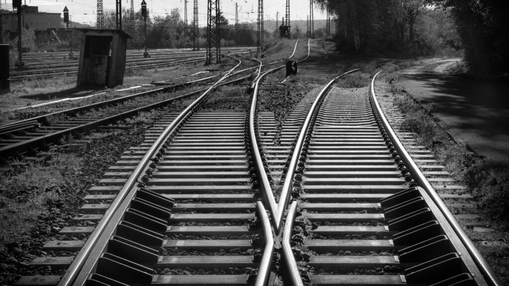 Train tracks crossings in a rail yard.